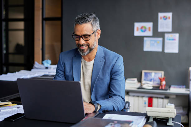 Professional using laptop with AI solution dashboards